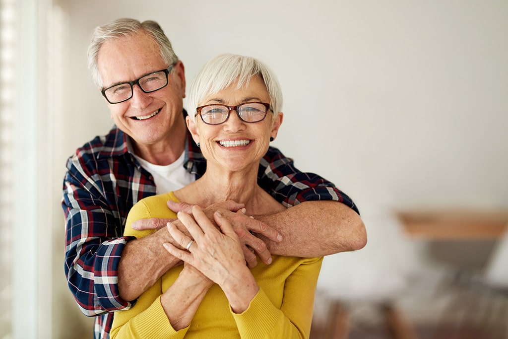 Couple hugging and smiling