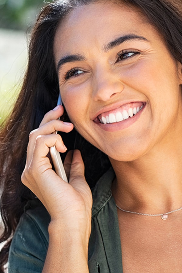 Smiling Woman Talking on Cell Phone
