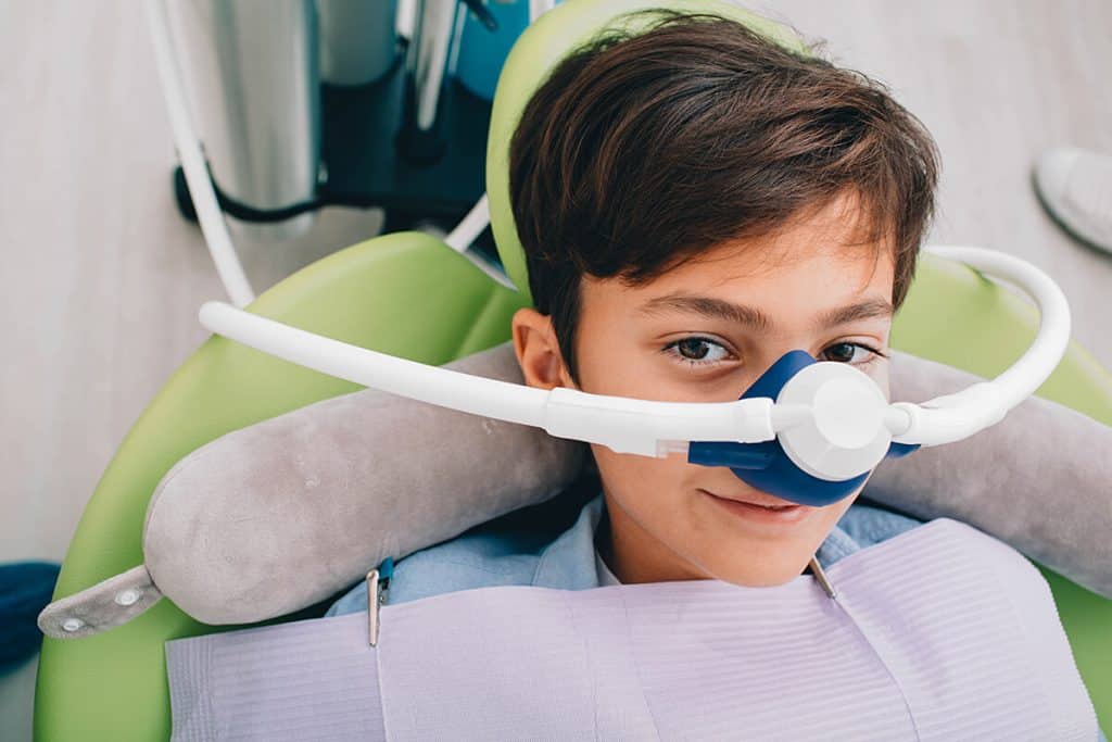 young boy with sedation dentistry respirator